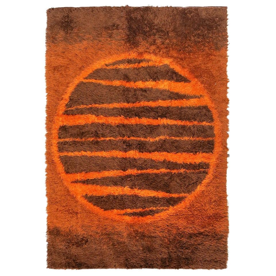 Supernova Shag Rug with Abstract Design, circa 1970: Title: Supernova Shag Rug with Abstract Design, circa 1970 Description: Swedish shag wool area rug with an abstract Supernova design resembling a sun featuring various shades of browns and burnt orang