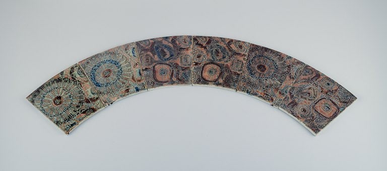 Royal Copenhagen, six Baca faience tiles with patterned glaze in brown, blue and green. (1 of 5)