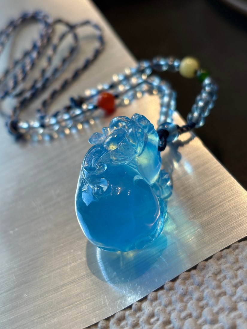 Natural Aquamarine Pendant - Pixiu,Certificate: Title: Natural Aquamarine Pendant - Pixiu,Certificate Origin: Chinese Date/Period: After2025 Materials: Aquamarine Dimensions: 30x19x20(mm) 1.18x0.75x0.79(inches) Weight 0.05 lbs/20.8g Reserve: