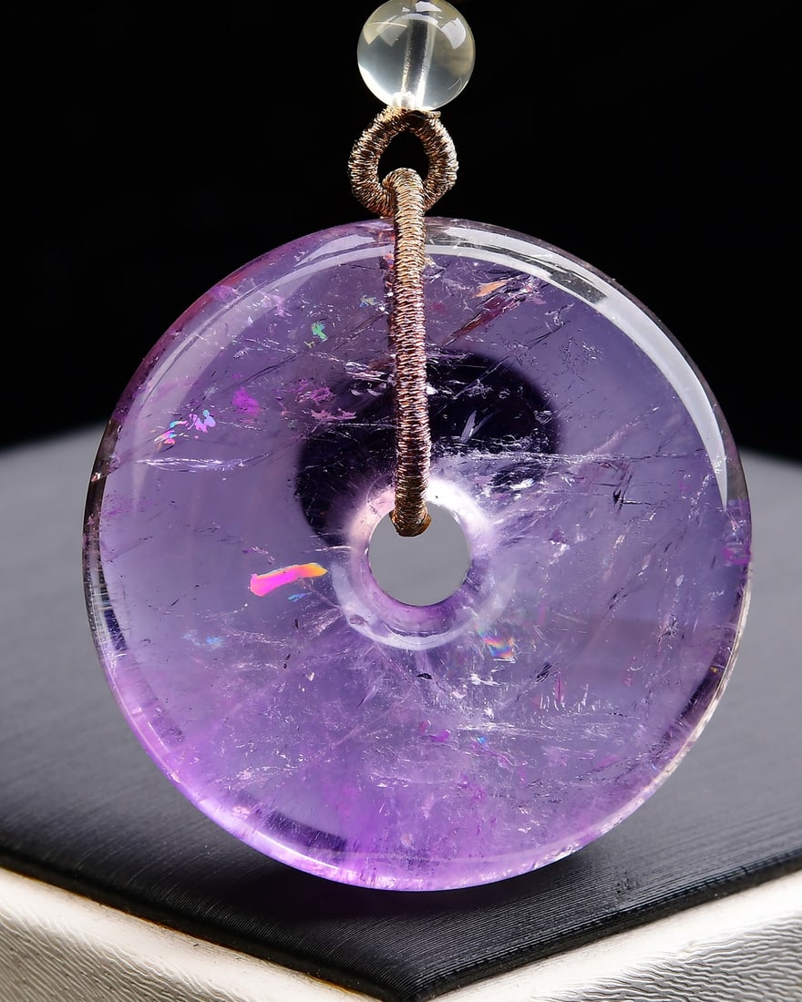 Natural Amethyst Lucky Pendant with Certificate: Title: Natural Amethyst Lucky Pendant with Certificate Origin: Chinese Date/Period: After2025 Materials: Amethyst Dimensions: 44x44x12(mm) 1.73x1.73x0.47(inches) Weight 0.09 lbs/42g Reserve: $120.00