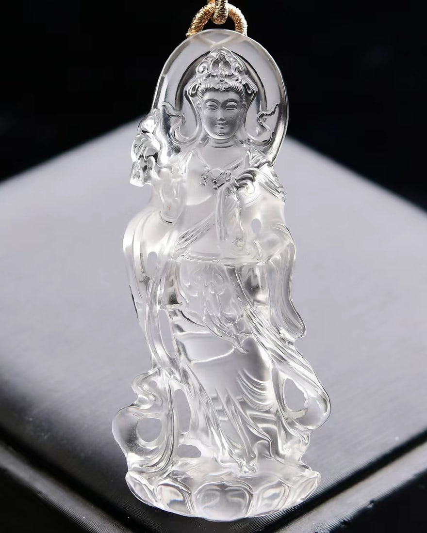 White Crystal Hand-Carved Kwan-yin Pendant: Title: White Crystal Hand-Carved Kwan-yin Pendant Origin: Chinese Date/Period: After2025 Materials: Crystal Dimensions: 65x30x13(mm) 2.56x1.18x0.51(inches) Weight 0.08 lbs/35g Reserve: $258.00 