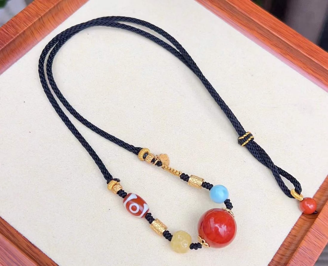 Hand knitting Nanhong Agate Lucky Ball Necklace: Title: Hand knitting Nanhong Agate Lucky Ball Necklace Origin: Chinese Date/Period: After2025 Materials: Nanhong Agate Dimensions: 17(mm) 0.67(inches) Weight 0.03 lbs/14.2g Reserve: $599.00 