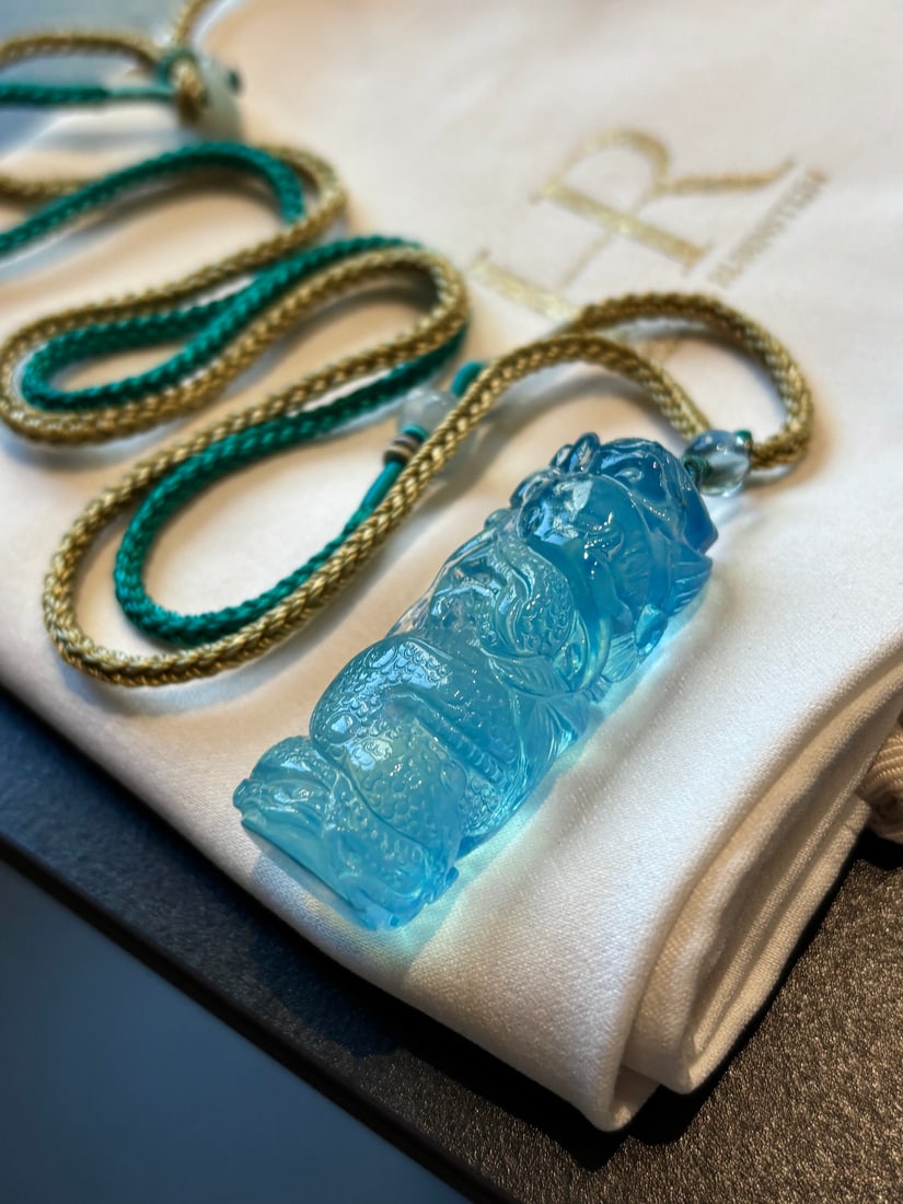 Natural Aquamarine Pendant - Dragon: Title: Natural Aquamarine Pendant - Dragon Origin: Chinese Date/Period: After2025 Materials: Aquamarine Dimensions: 44x18(mm) 1.73x0.71(inches) Weight 0.05 lbs/23.5g Reserve: $349.00 