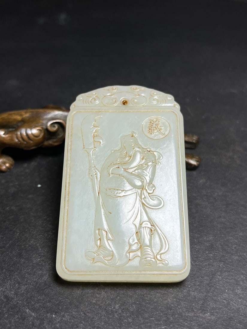 Hetian Jade Pendant - Guangong: Title: Hetian Jade Pendant - Guangong Origin: Chinese Date/Period: After2000 Materials: Hetian Jade Dimensions: 70x41x9(mm) 2.76x1.61x0.35(inches) Weight 0.14 lbs/63g Reserve: $288.00 Shipping: Domes