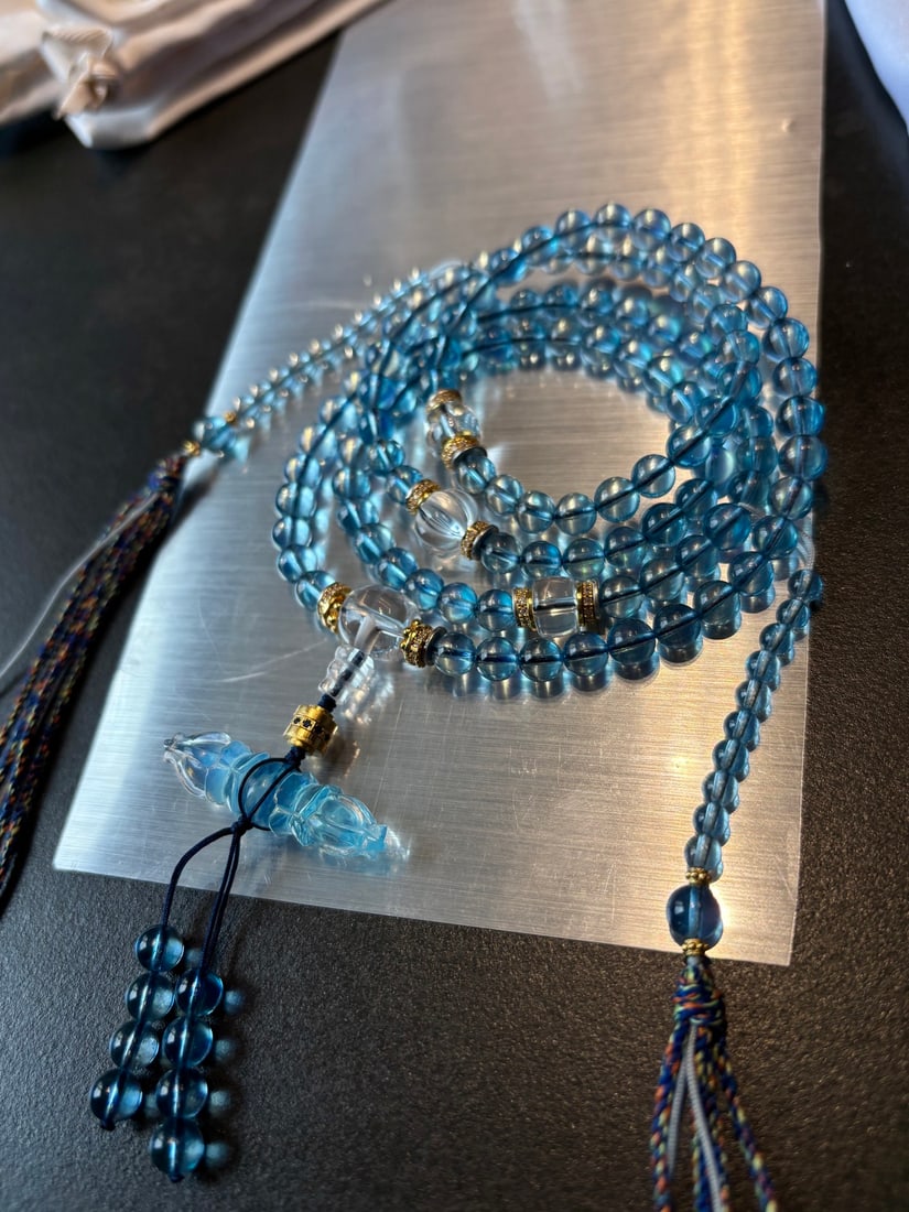 108 Beads Natural Aquamarine Hand Chain Necklace: Title: 108 Beads Natural Aquamarine Hand Chain Necklace Origin: Chinese Date/Period: After2025 Materials: Aquamarine Dimensions: 6.2(mm) 0.24(inches) Weight 0.12 lbs/55.2g Reserve: $685.00 
