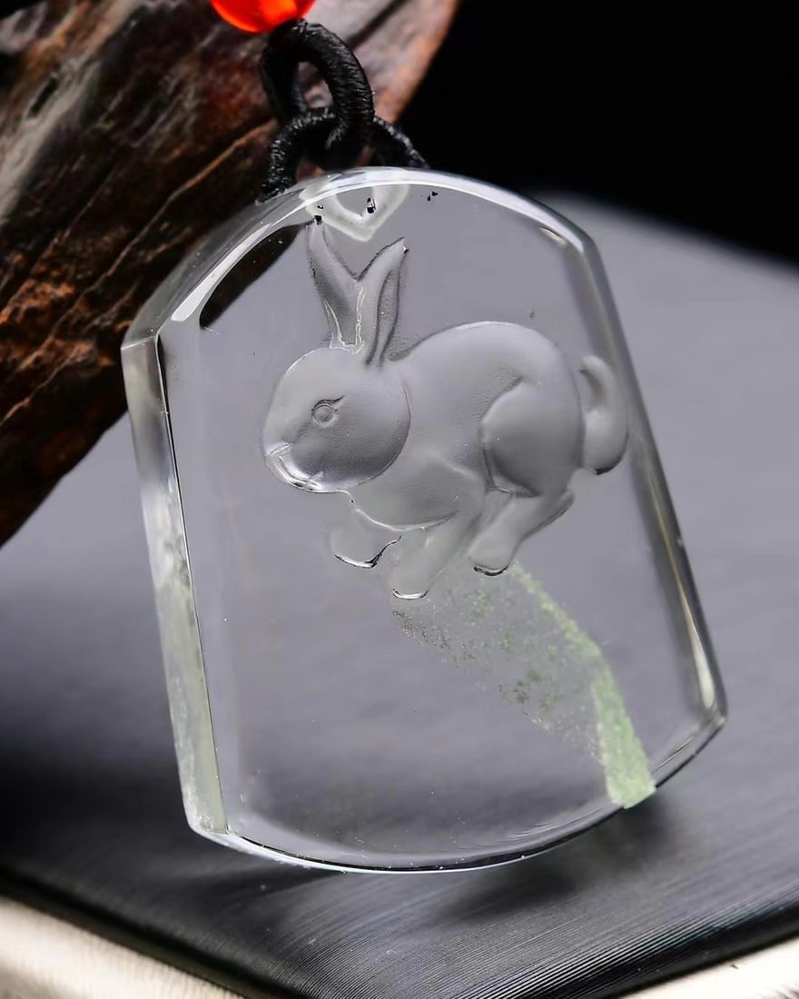 Crystal Pendant - Rabbit,Certificate: Title: Crystal Pendant - Rabbit,Certificate Origin: Chinese Date/Period: After2025 Materials: Crystal Dimensions: 38x28x14(mm) 1.50x1.10x0.55(inches) Weight 0.07 lbs/30g Reserve: $99.00 Shipping: Dom