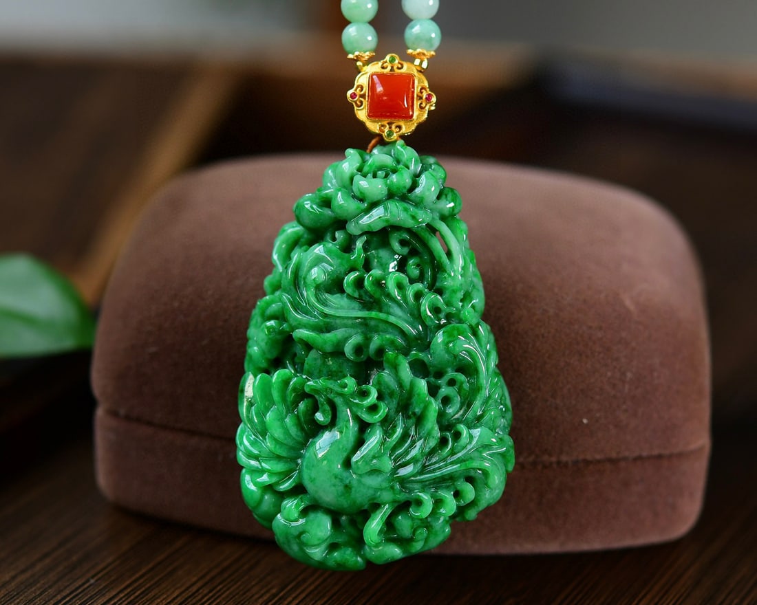 Natural Green Jadeite Hand-Carved Phoenix,Flower Pendant with Certificate: Title: Natural Green Jadeite Hand-Carved Phoenix,Flower Pendant with Certificate Origin: Chinese Date/Period: After2025 Materials: Jadeite Dimensions: 61x37x12(mm) 2.40x1.46x0.47(inches) Reserve: $1,6