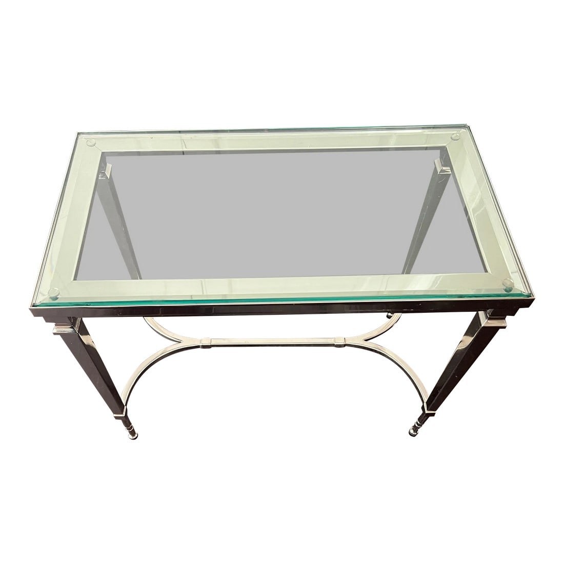 Williams Sonoma Home Metallic or Chrome & Glass Coffee Table: This is a simple, yet classic and elegant side table. Perfectly sophisticated for a living or casually chic for a family room. It has a shiny chrome finish and is topped with glass. Measures 17.5"