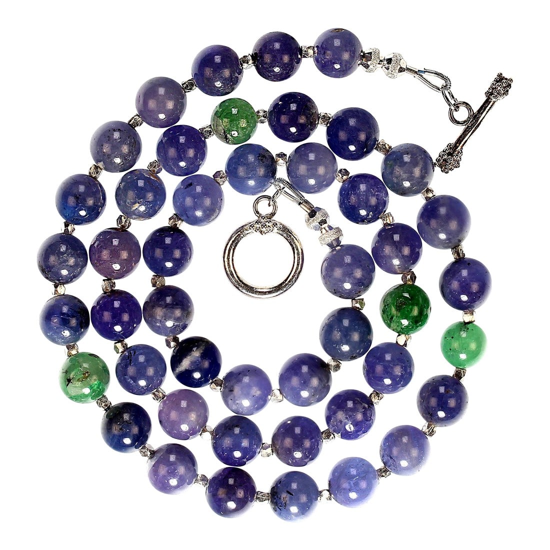 Translucent Tanzanite and Fine Silver Necklace: This is part of Chairish's Fine Jewelry assortment. Elevate your jewelry collection with this stunning 20-inch necklace featuring unique, translucent tanzanite gemstones in captivating shades of