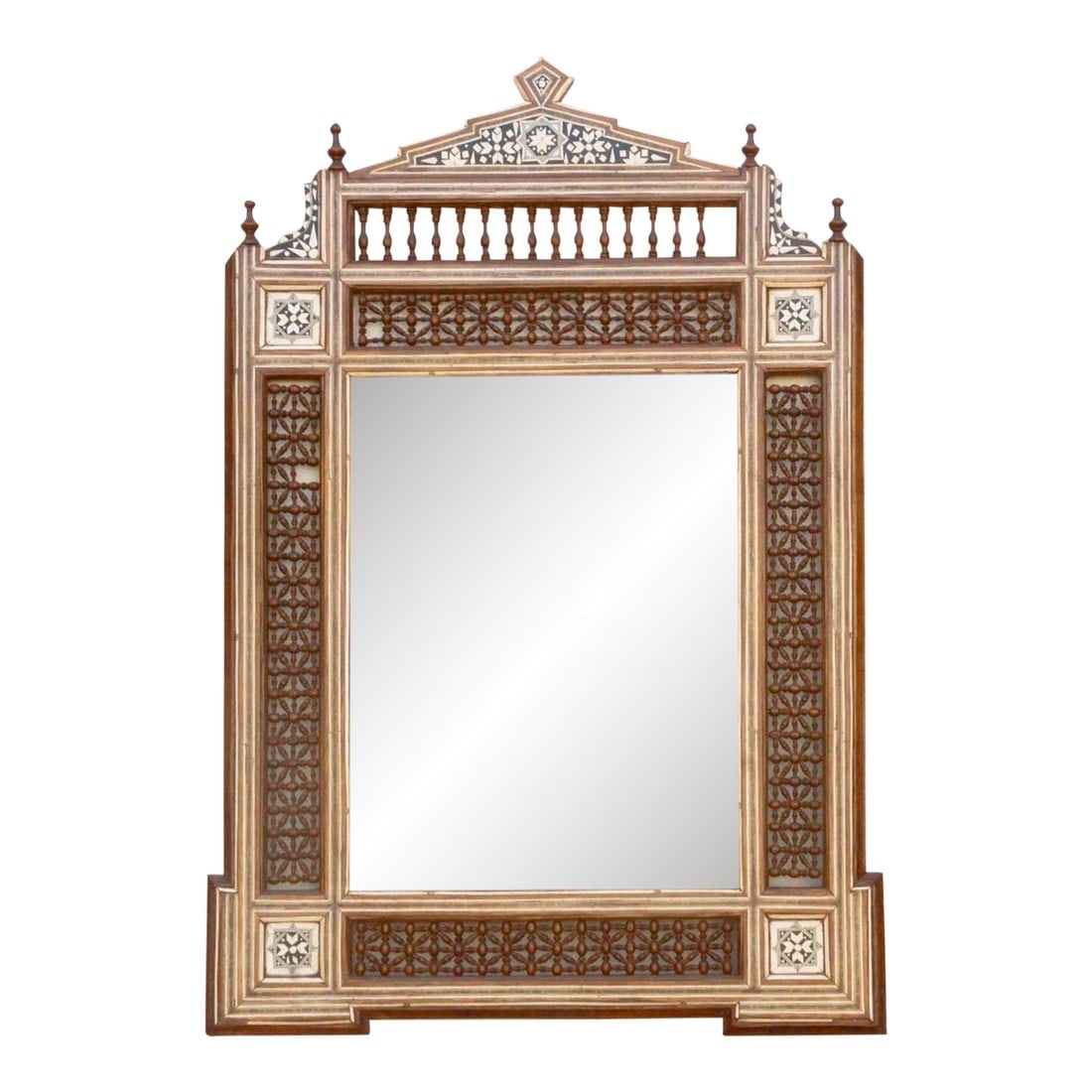 Mid-Century Moorish Inlaid Mirror: This very decorative Middle Eastern mirror features a crown shaped top and intricate wooden Mousharabi lattice and spindle designs on each side of its frame. Ornate and geometric patterns made using
