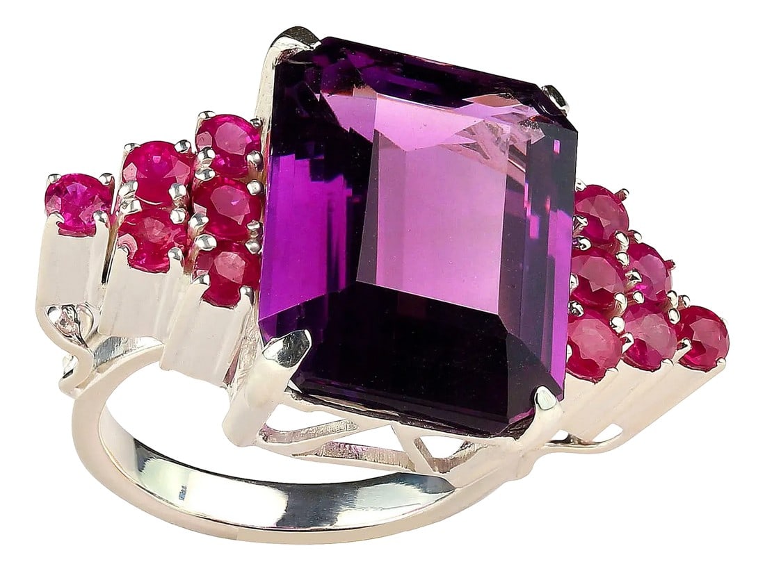 Amethyst and Ruby Dinner Ring February Birthstone: Statement Cocktail Ring: 16.39ct Amethyst with Pink Sapphire Accents Turn heads with this stunning cocktail ring featuring a 16.39 carat square-cut Amethyst, accented by 12 sparkling Pink Sapphires