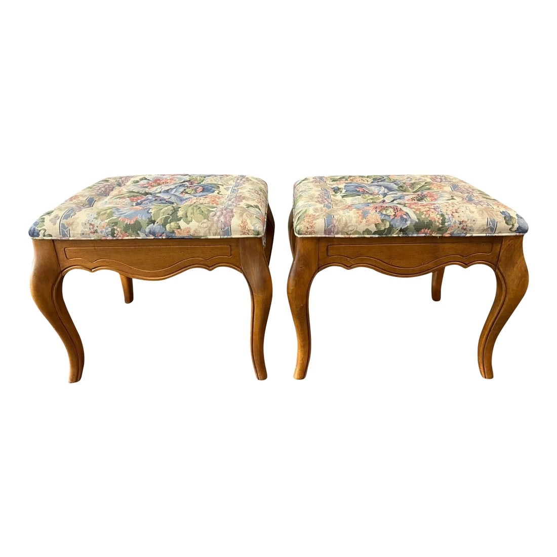 Late 20th Century Ethan Allen Attributed Ottomans - a Pair: Quick Hits: - Pair of vintage floral upholstered ottomans - Light wood frames with elegant cabriole legs - Charming floral upholstery in soft pastels - French country style More About This Item: