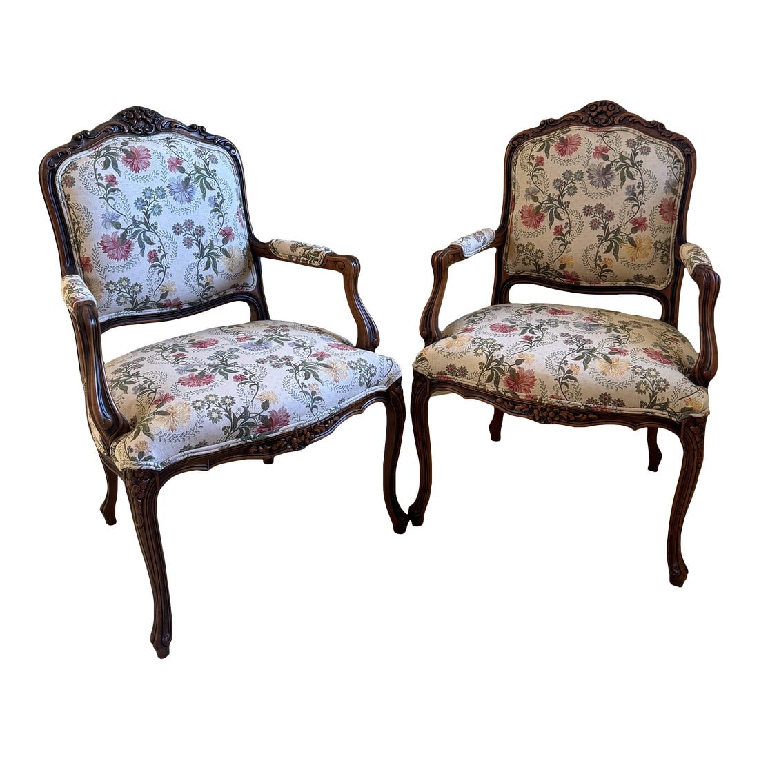 Early 20th Century Antique French Louis XV Style Upholstered Carved Mahogany Arm Chairs - Set of Two: These antique Louis XV style carved mahogany upholstered armchairs, circa early 20th century, will add a classic touch to your contemporary style. They are clean and fresh looking with their floral up