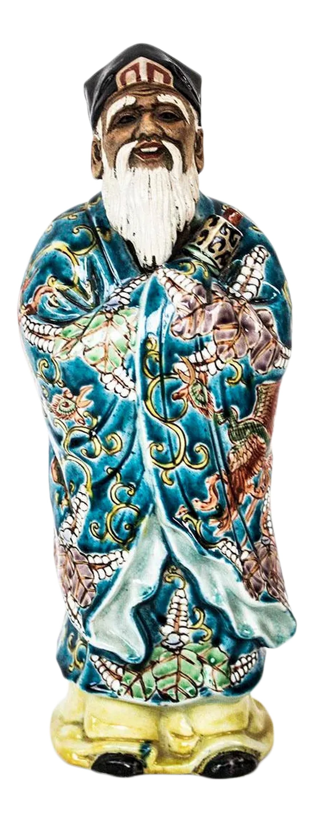 Chinese Porcelain Figurine Holding Scroll Statue: Vintage Chinese figurine of a scholar holding a scroll. Glossy finish, beautifully painted all around. Unmarked with age estimated. A photo of the bottom is included which shows evidence of where a