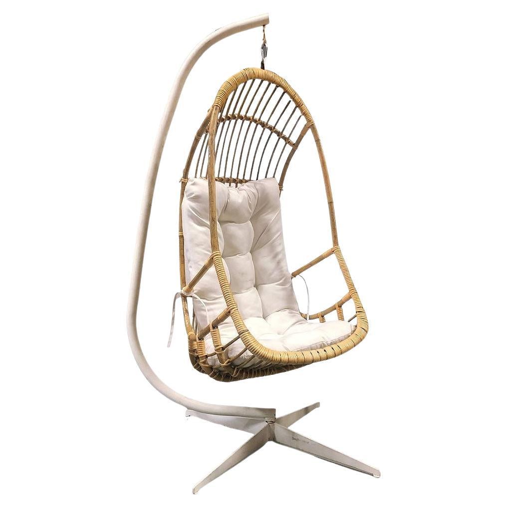 Restored Mid-century Rattan & Wicker Hanging Cocoon Egg Chair w/ Stand: Title: Restored Mid-century Rattan & Wicker Hanging Cocoon Egg Chair w/ Stand Description: This beautifully restored rattan hanging cocoon egg chair is made from a solid pole rattan frame, with a reed