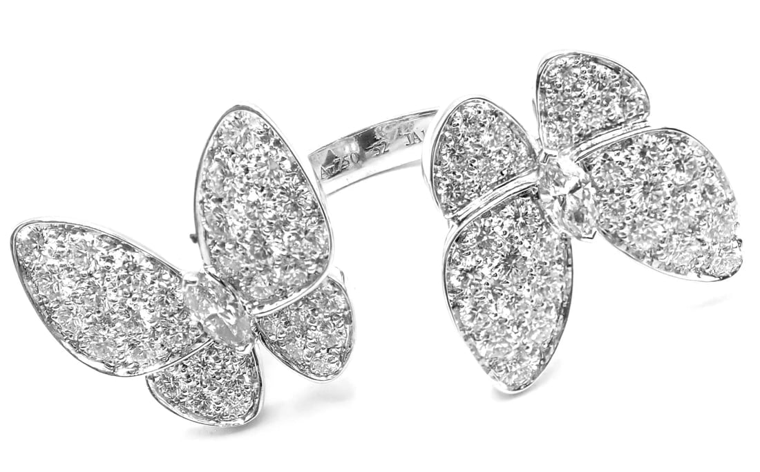 Van Cleef & Arpels 18k White Gold Diamond Two Butterfly Between Finger Ring: Title: Van Cleef & Arpels 18k White Gold Diamond Two Butterfly Between Finger Ring Description: Van Cleef & Arpels 18k White Gold Diamond Two Butterfly Between Finger Ring About This Piece: This ring