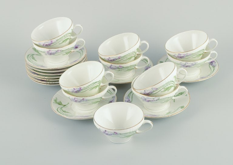 Rörstrand, Sweden. A set of eleven Art Nouveau porcelain teacups with saucers.: Rörstrand, Sweden. A set of eleven Art Nouveau porcelain teacups with saucers. Hand painted with motifs of purple flowers. Approx. 1910s. In excellent condition. First factory quality. Marked in