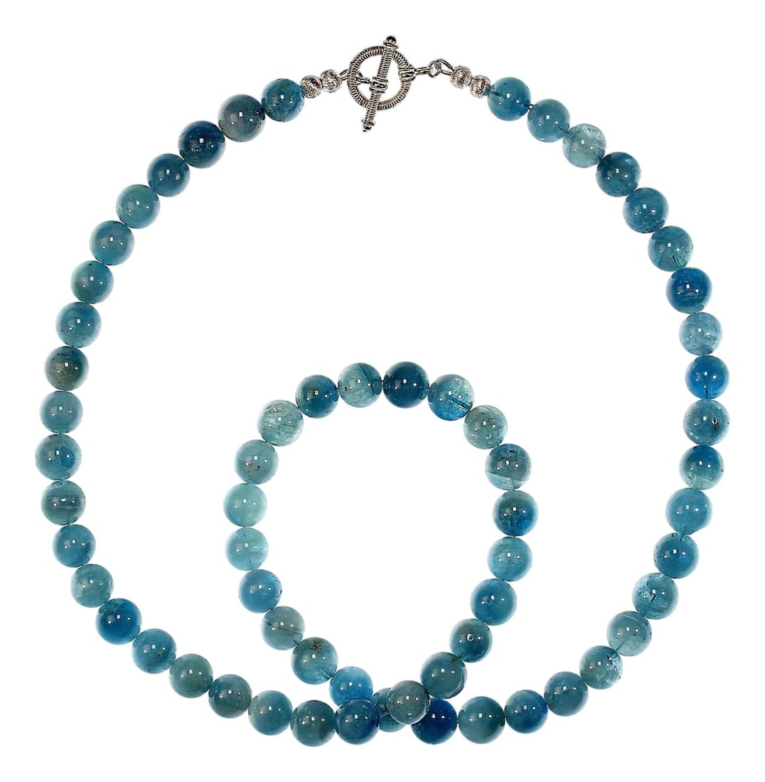 Ajd 27 Inch Translucent Aquamarine Necklace March Birthstone: A 27"‘inch translucent aquamarine necklace offers a graceful blend of color, clarity, and timeless charm. Each 10"¯mm aquamarine gemstone displays a soft, watery blue tone that catches the light