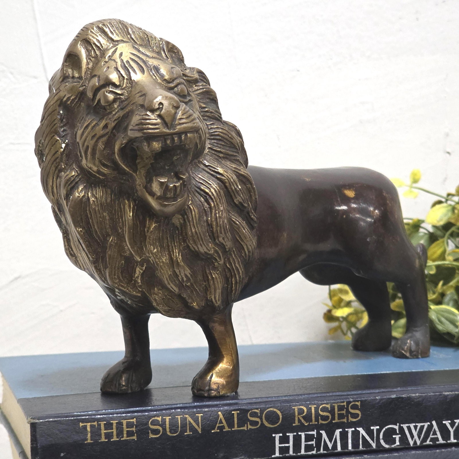 Cast Brass Lion Figurine, Safari Decor Hollywood Regency Mantel Accent: Title: Cast Brass Lion Figurine, Safari Decor Hollywood Regency Mantel Accent Description: Solid cast lion figure with a bold, sculptural profile—perfect for shelf styling, a mantel moment, or