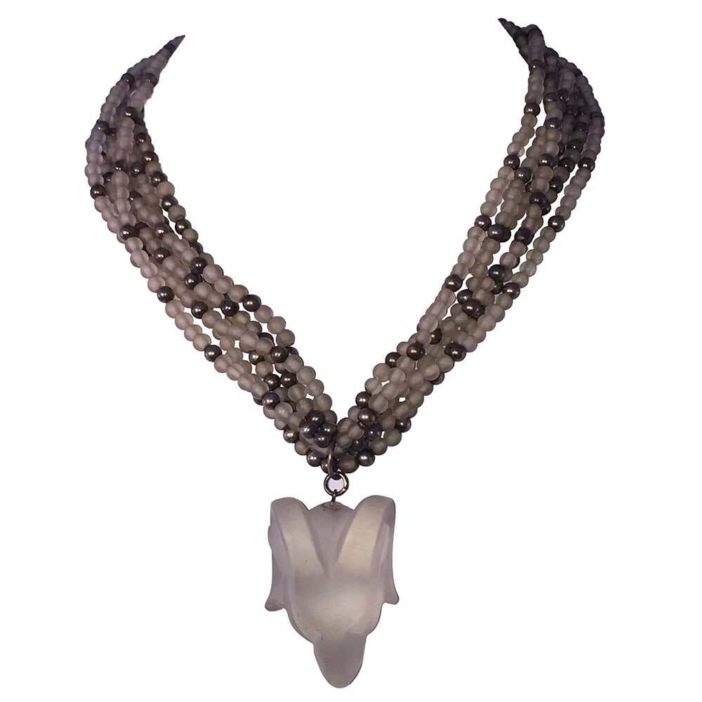 Ram Head Sterling and Camphor Glass Bead Torsade Necklace: Title:Ram Head Sterling and Camphor Glass Bead Torsade NecklaceDescription:Ram Head Sterling and Camphor Glass Bead Torsade Necklace. Circa 1950's. Measures 16 1/2" long and 1" wide without the