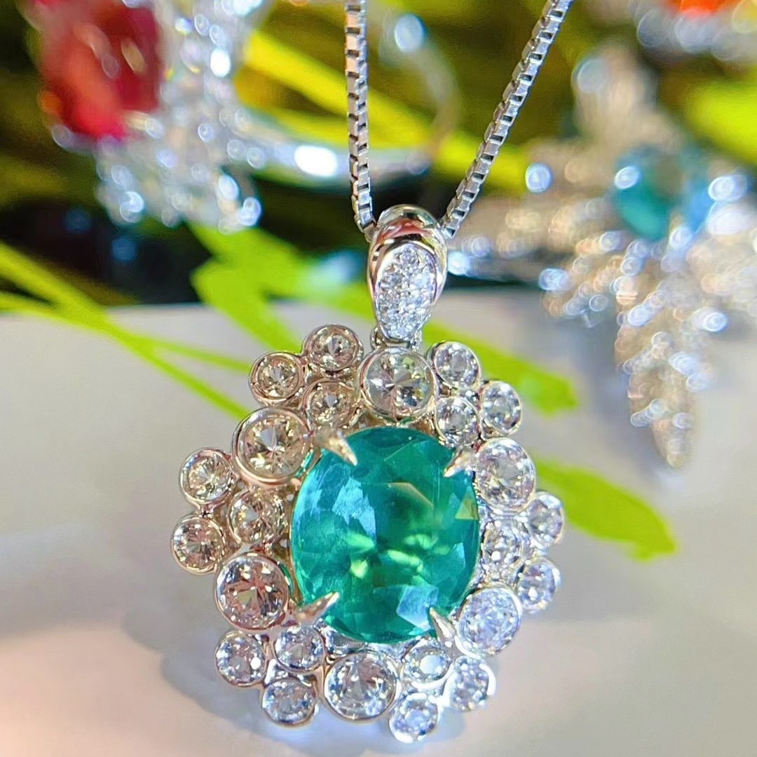 14K GOLD 1.62 CT NATURAL PARAIBA TOURMALINE & DIAMOND & SAPPHIRE PENDANT: Title:14K GOLD 1.62 CT NATURAL PARAIBA TOURMALINE & DIAMOND & SAPPHIRE PENDANTDescription:Ref:230656037Gold Content:14K GoldMain Gemstone:Paraiba TourmalineNumber of stones:1Shape:OvalCarat