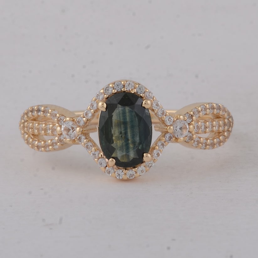 1.21 Ct Oval Blue Sapphire 9K Gold Ring: 1.21 Total Carat Blue Sapphire 9K Gold Ring Specifications: Total Weight 2.09 g Center Gemstone Blue Sapphire Gemstone Carat Weight 0.84 Carats Gemstone Measurements 7.20X5X2.40 mm Additional