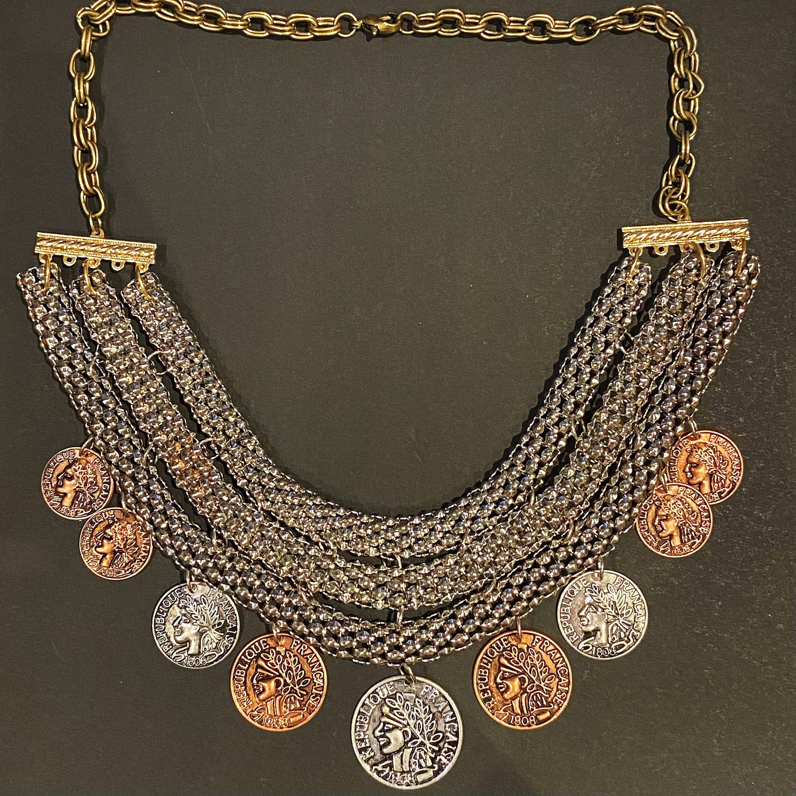 1808 FRANCAISE REPUBLIQUE Coin Replica Bib Necklace: Title: 1808 FRANCAISE REPUBLIQUE Coin Replica Bib NecklaceDescription:A rare find for sure, and a treasure to be had for many more years to come. This beauty is made of a mixed metal in a vintage