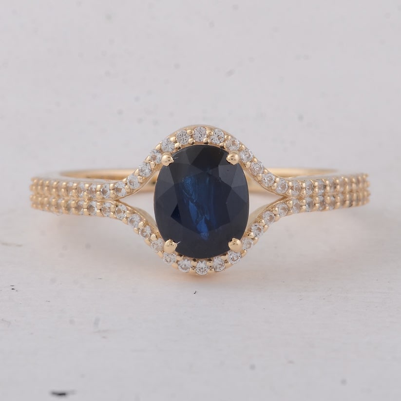 1.74 Ct Oval Sapphire 9K Gold Ring: 1.74 Total Carat Sapphire 9K Gold Ring Specifications: Total Weight 2.27 g Center Gemstone Sapphire Gemstone Carat Weight 1.47 Carats Gemstone Measurements 6.90X5.80X4.10 mm Additional Gemstones