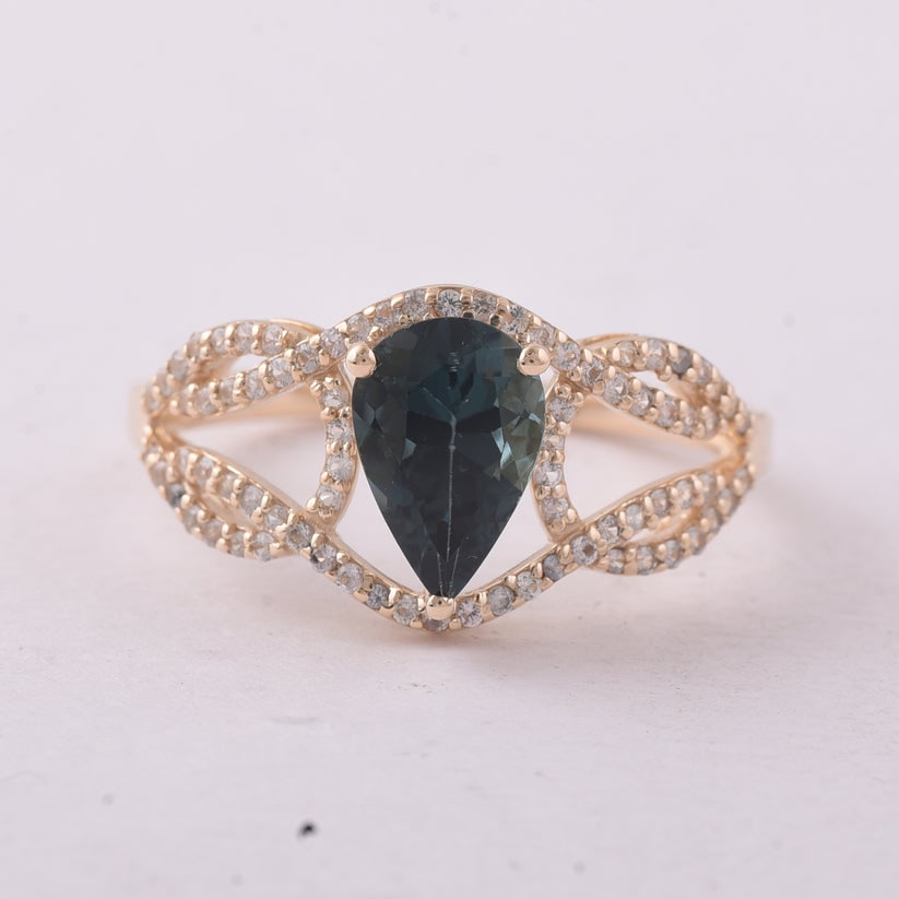 1.35 Ct Pear Tourmaline 9K Gold Ring: 1.35 Total Carat Tourmaline 9K Gold Ring Specifications: Total Weight 2.28 g Center Gemstone Tourmaline Gemstone Carat Weight 1.12 Carats Gemstone Measurements 9X6 mm Additional Gemstones White
