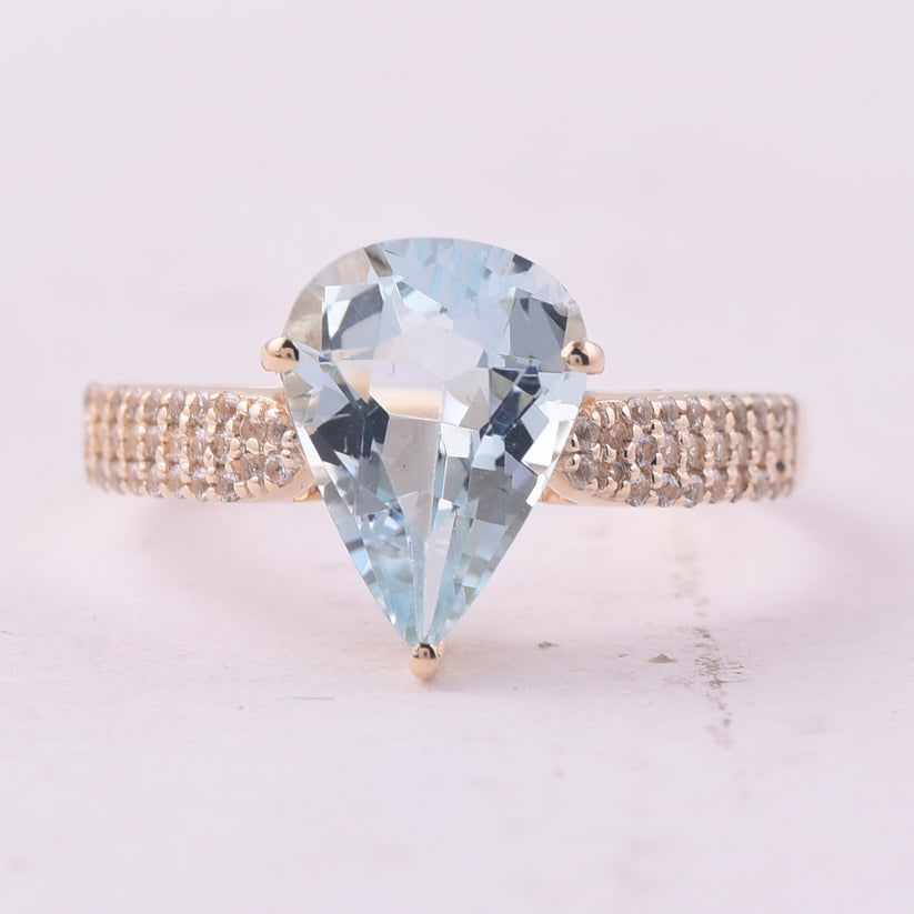 2.24 Ct Pear Aquamarine 9K Gold Ring: 2.24 Total Carat Aquamarine 9K Gold Ring Specifications: Total Weight 2.28 g Center Gemstone Aquamarine Gemstone Carat Weight 1.99 Carats Gemstone Measurements 11X8X5 mm Additional Gemstones White Sap