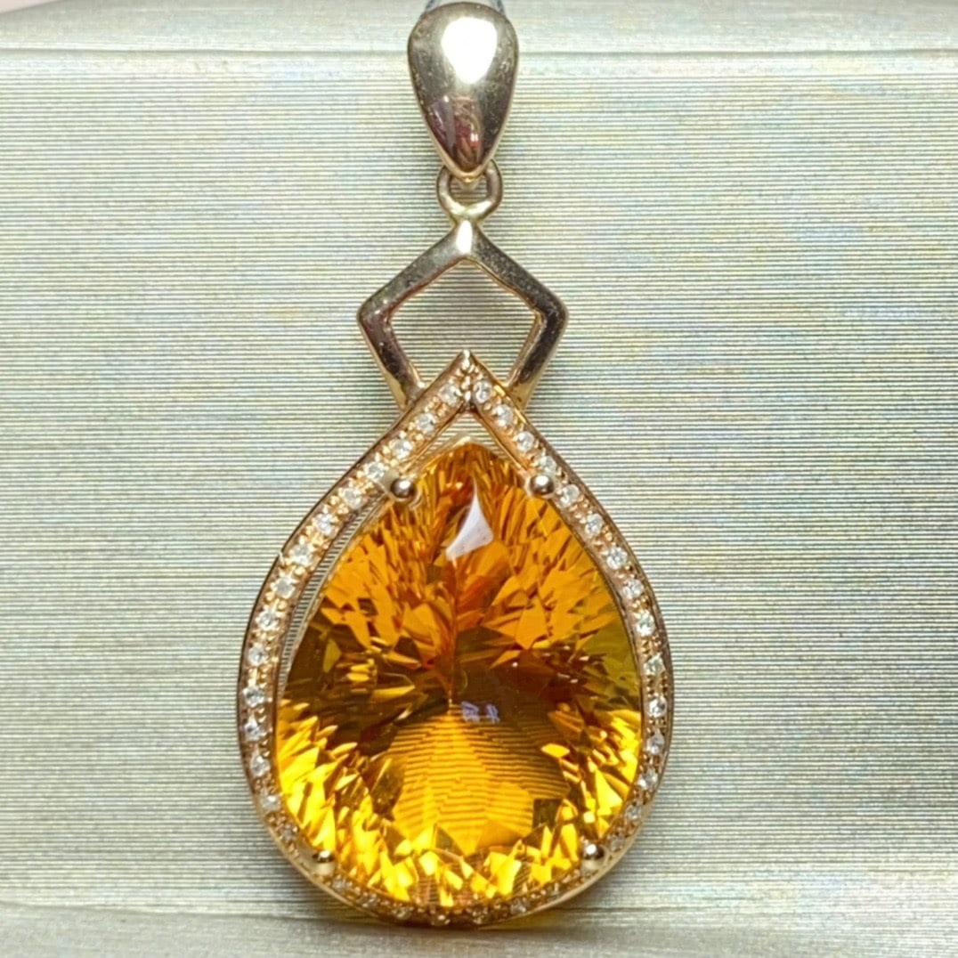 14K GOLD 11.12 CTW NATURAL CITRINE & DIAMOND PENDANT: Title:14K GOLD 11.12 CTW NATURAL CITRINE & DIAMOND PENDANTDescription:Ref:230656038Gold Content:14K GoldMain Gemstone:CitrineNumber of stones:1Shape:PearCarat Weight:11ct