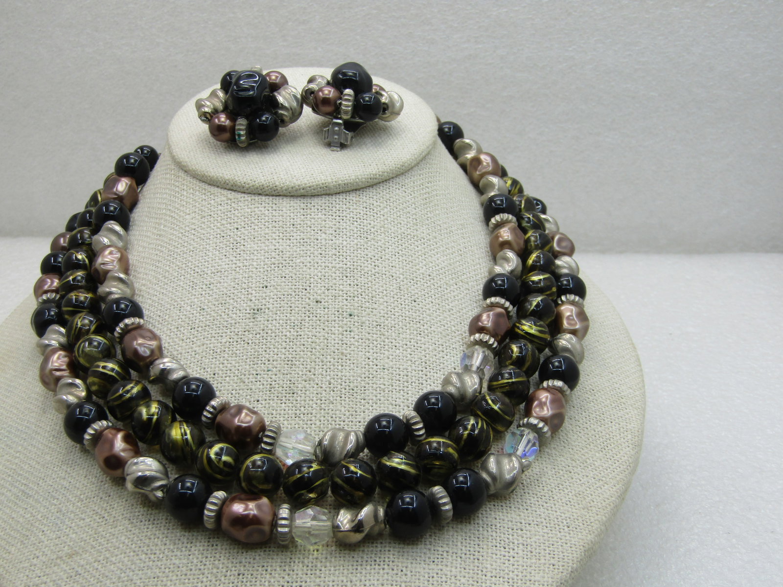 Vintage Black, Gold Beaded Multi-Strand Necklace Earrings Set, 17", 1950's-1960's: Vintage Black, Gold Beaded Multi-Strand Necklace Earrings Set, 17", 1950's-1960's, triple strand of black round 10mm beads and a mix of metallic nugget beads and gold tone twisted beads with faceted