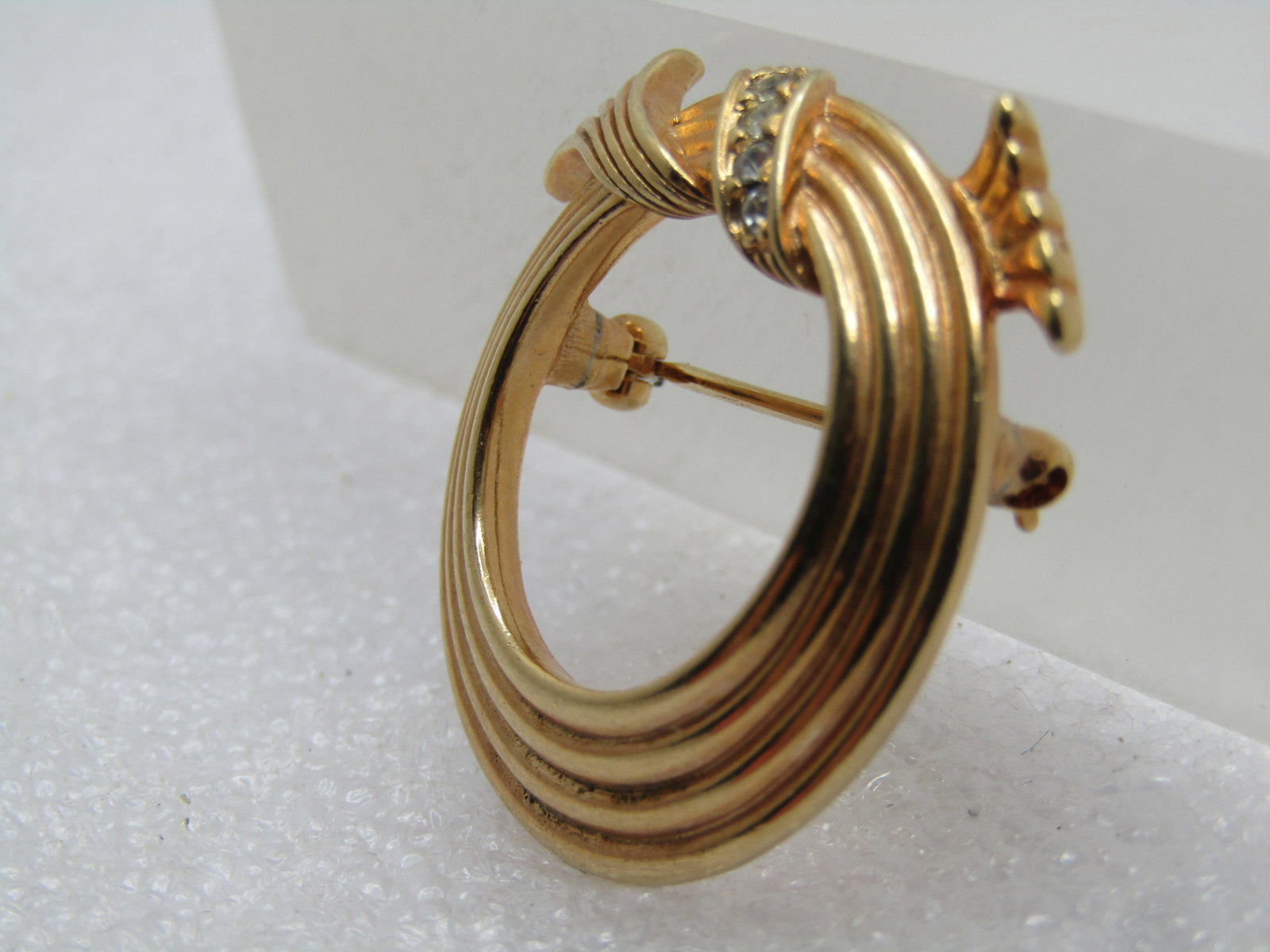 Vintage Circle Brooch with Rhinestone Looped Bow on Top, Signed Avon, 1970's - 2