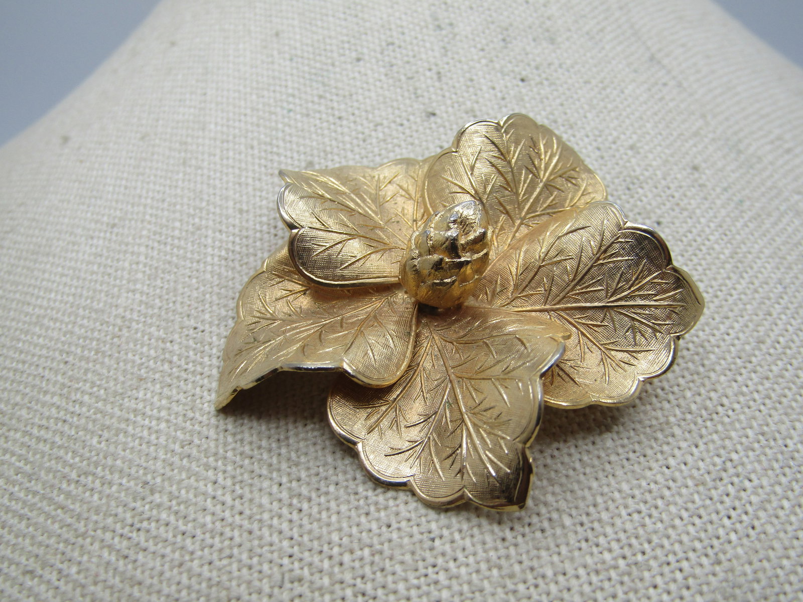 Vintage Gold Tone Blossom Brooch, 3-D, 1960's,: Vintage Gold Tone Blossom Brooch, 3-D, 1960's. textured curved and raised and angled petals with raised veining in the petals and a center to the blossom that has the look of a pine cone, but it is