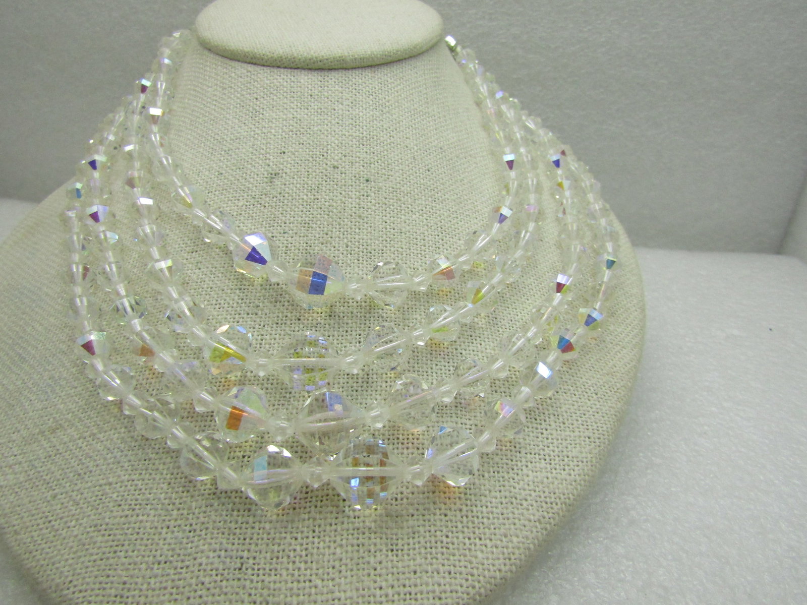 Vintage 4 Strand Aurora Borealist Crystal Necklace, 16": Vintage 4 Strand Aurora Borealist Crystal Necklace, 16" including extender chain , ornate silver tone rhinestone end caps. Beads are graduated from 6.5mm to 11mm with smaller diamond shaped spacer