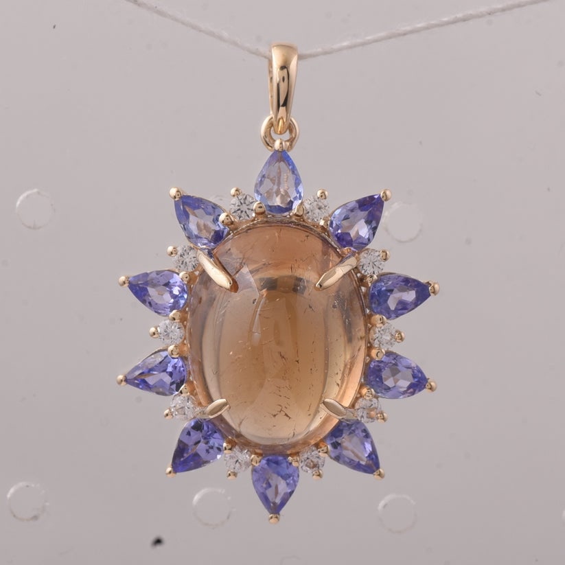 11.37 Ct Oval Tourmaline 9K Gold Pendant: 11.37 Total Carat Tourmaline 9K Gold PendantSpecifications: Total Weight 3.926 g Center Gemstone Tourmaline Gemstone Carat Weight 9.9 Carats Gemstone Measurements 14.60X11.20X8.40 mm Additional
