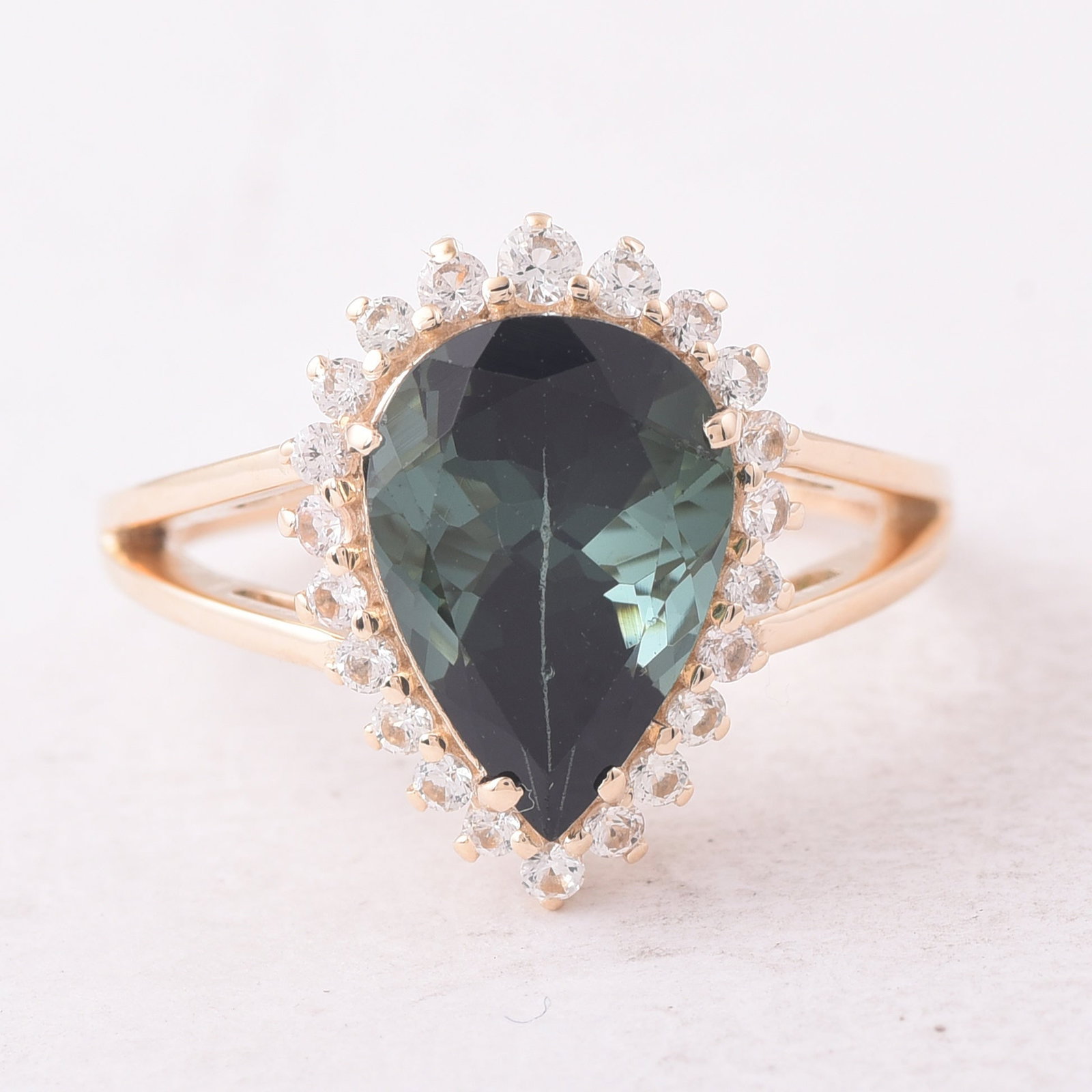 4.24 Ct Pear Tourmaline 9K Gold Ring: 4.24 Total Carat Tourmaline 9K Gold RingSpecifications: Total Weight 3.474 g Center Gemstone Tourmaline Gemstone Carat Weight 3.79 Carats Gemstone Measurements 12.50X8.60X6.50 mm Additional Gemstones