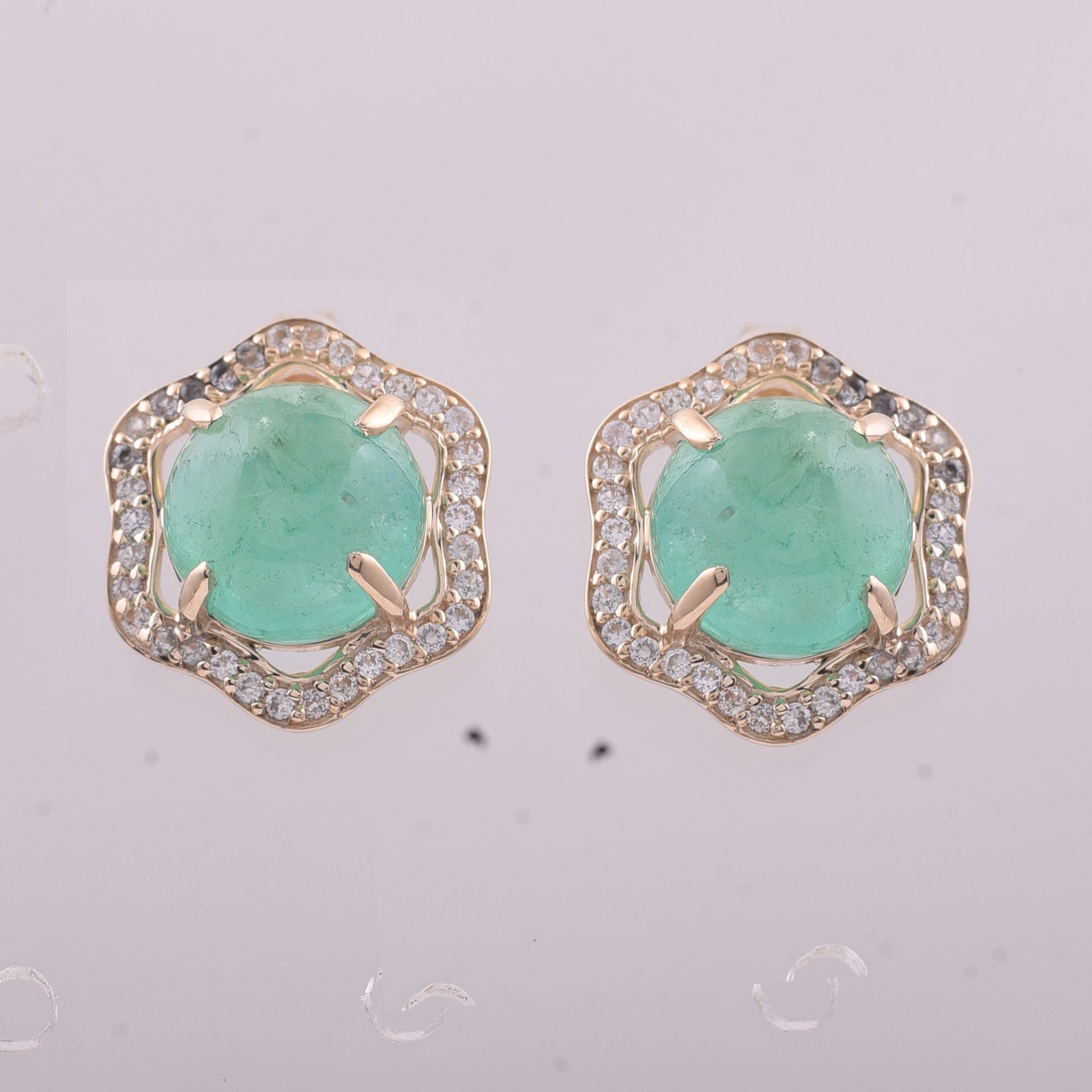 5.12 Ct Round Emerald 9K Gold Earrings: 5.12 Total Carat Emerald 9K Gold EarringsSpecifications: Total Weight 2.722 g Center Gemstone Emerald Gemstone Carat Weight 4.82 Carats Gemstone Measurements 8 mm Additional Gemstones White Sapphire