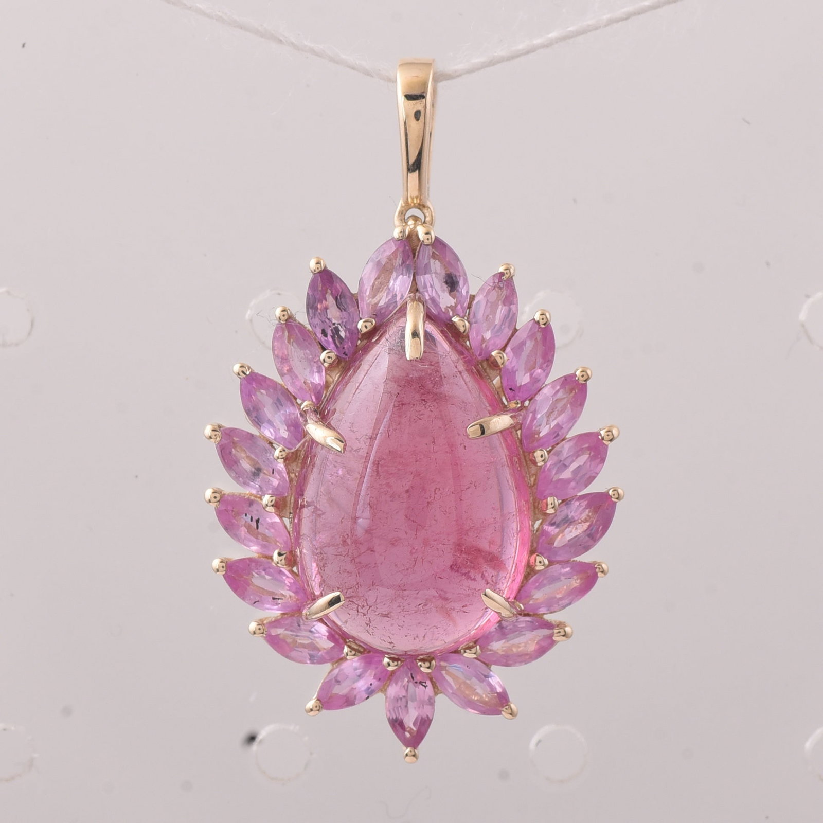 8.32 Ct Pear Tourmaline 9K Gold Pendant: 8.32 Total Carat Tourmaline 9K Gold PendantSpecifications: Total Weight 3.298 g Center Gemstone Tourmaline Gemstone Carat Weight 6.7 Carats Gemstone Measurements 14.90X10X5.60 mm Additional Gemstones