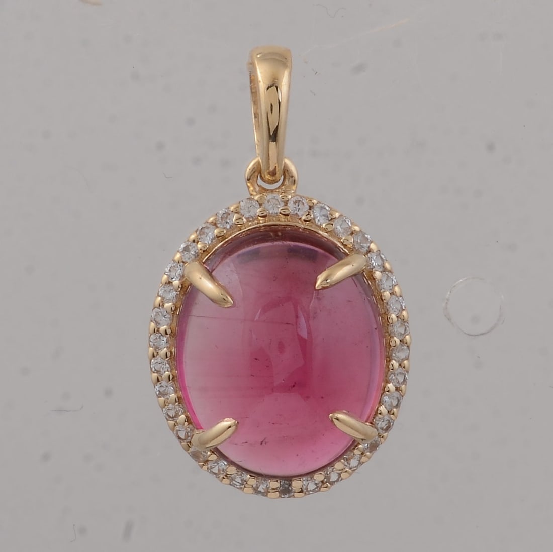 3.33 Ct Oval Tourmaline 9K Gold Pendant: 3.33 Total Carat Tourmaline 9K Gold PendantSpecifications: Total Weight 3.33 g Center Gemstone Tourmaline Gemstone Carat Weight 3.2 Carats Gemstone Measurements 10.80X9X4.40 inch Additional Gemstones