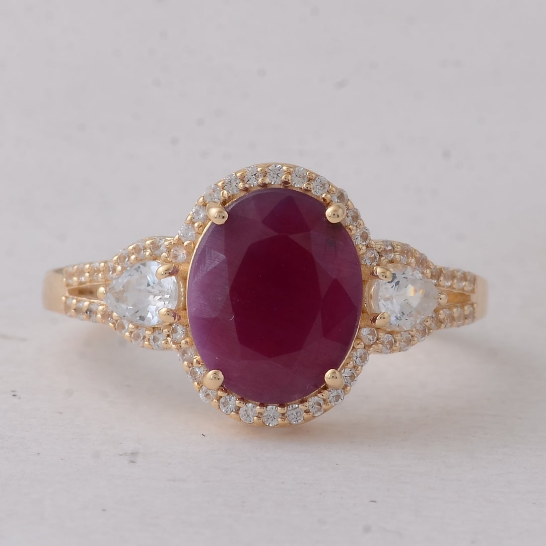 4.01 Ct Oval Ruby 9K Gold Ring: 4.01 Total Carat Ruby 9K Gold Ring Specifications: Total Weight 3.041 g Center Gemstone Ruby Gemstone Carat Weight 3.35 Carats Gemstone Measurements 10X8 mm Additional Gemstones White Sapphire Additio