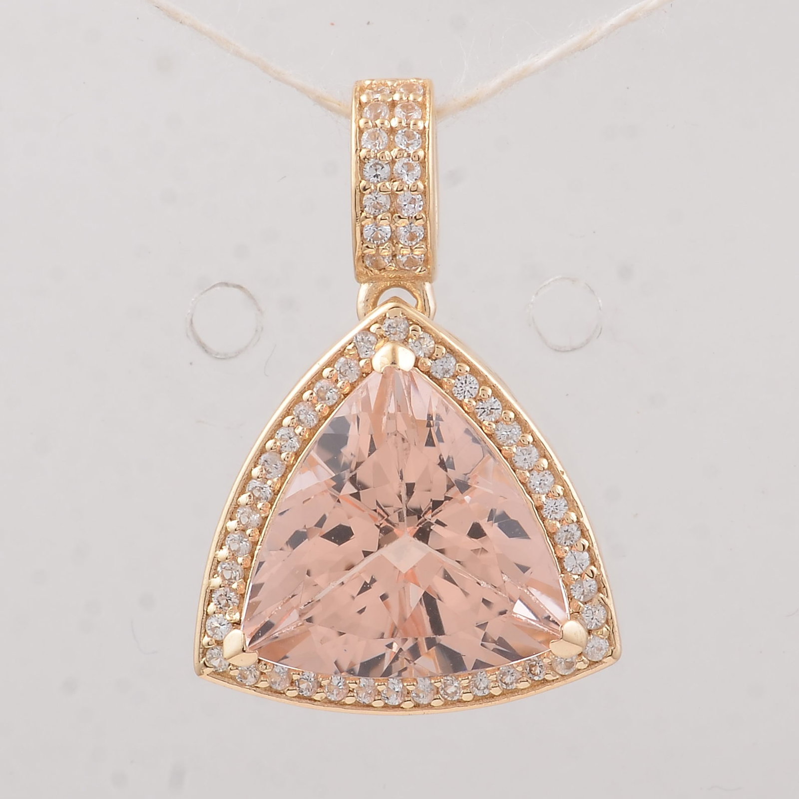 4.03 Ct Trillion Morganite 9K Gold Pendant: 4.03 Total Carat Morganite 9K Gold PendantSpecifications: Total Weight 2.57 g Center Gemstone Morganite Gemstone Carat Weight 3.79 Carats Gemstone Measurements 10.70X10.70X7 mm Additional Gemstones