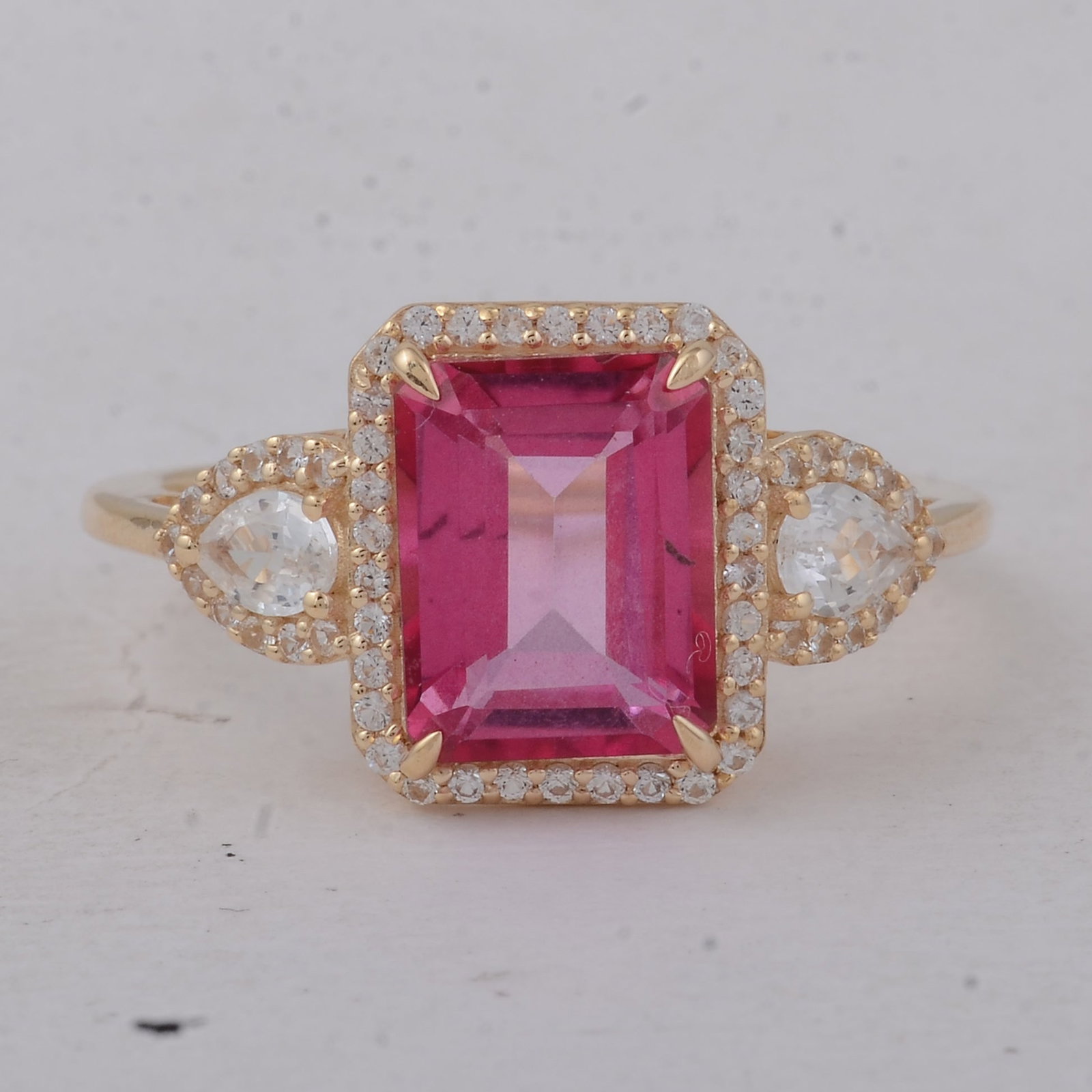 3.57 Ct Octagon Pink Topaz 9K Gold Ring: 3.57 Total Carat Pink Topaz 9K Gold Ring Specifications: Total Weight 2.84 g Center Gemstone Pink Topaz Gemstone Carat Weight 3.02 Carats Gemstone Measurements 9X7 mm Additional Gemstones White Sapphi
