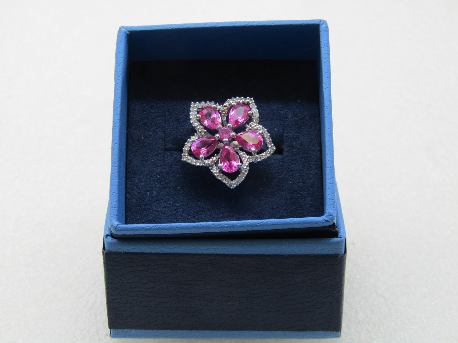 Sterling Silver Lab Pink Ruby Floral Ring, Clear CZ, Sz. 10.5: Sterling Silver Lab Pink Ruby Floral Ring, Clear CZ, Sz. 10.5, appx. 4.94 gr. The ring has 5 pear shaped pink stones that test as ruby, lab grown. The stones are apx. 6mm long with the rounded end on