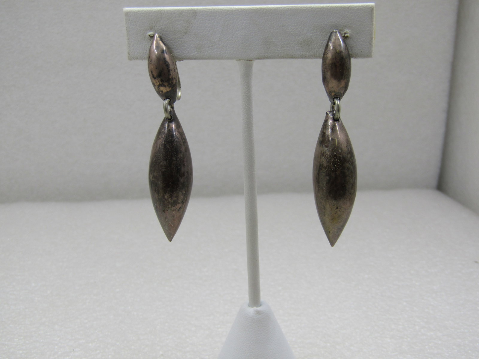 Vintage Sterling Mexican Drop Earrings, Screwback - Mid-Century, Signed: Vintage Sterling Mexican Drop Earrings, Screwback - Mid-Century. They have a domed cateye shaped stud from which a puffy drop dangles, an elongated pointed bead. The total length of the earrings is 2.