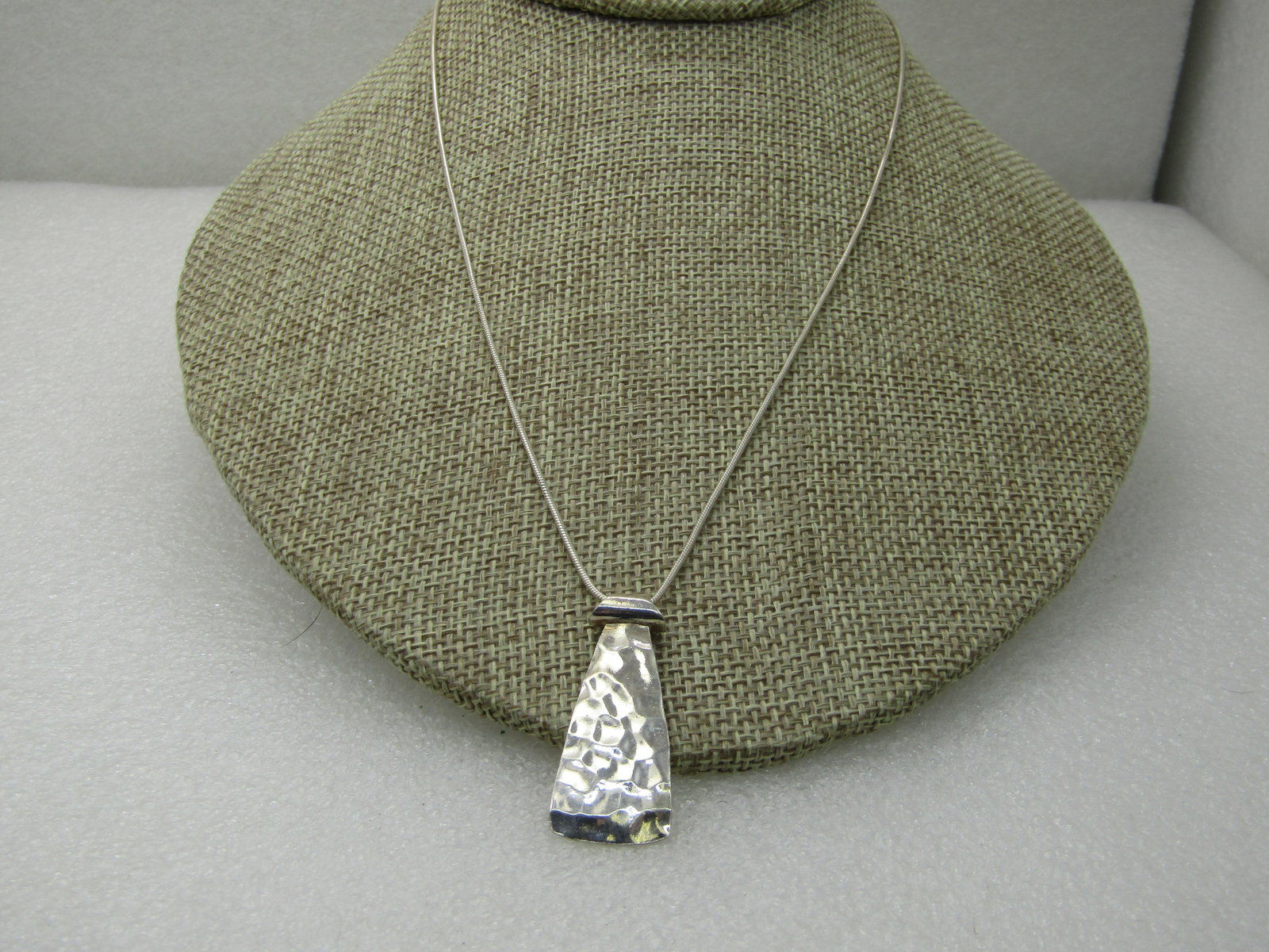 Vintage Silpada Sterling Brutalist Necklace, Hammered Pendant, 18": Vintage Silpada Sterling Brutalist Necklace, Hammered Pendant, 18" and appx. 7.43 grams. 18" snake chain that is appx. .9mm, lobster clasp, Both pieces are signed Silpada. The pendant is a hammered pa