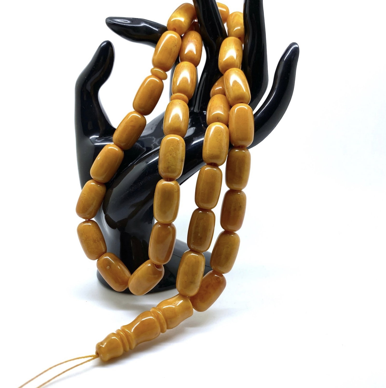 Exquisite Unique Antique Amber Tesbih made from Barrel shaped Amber beads: Title:Exquisite Unique Antique Amber Tesbih made from Barrel shaped Amber beadsMetal:NoneGemstone:AmberWeight:57.9 gSize:Bead size: 19.0 x 11.0 mm Bead size: 0.748 x 0.433 inches Made