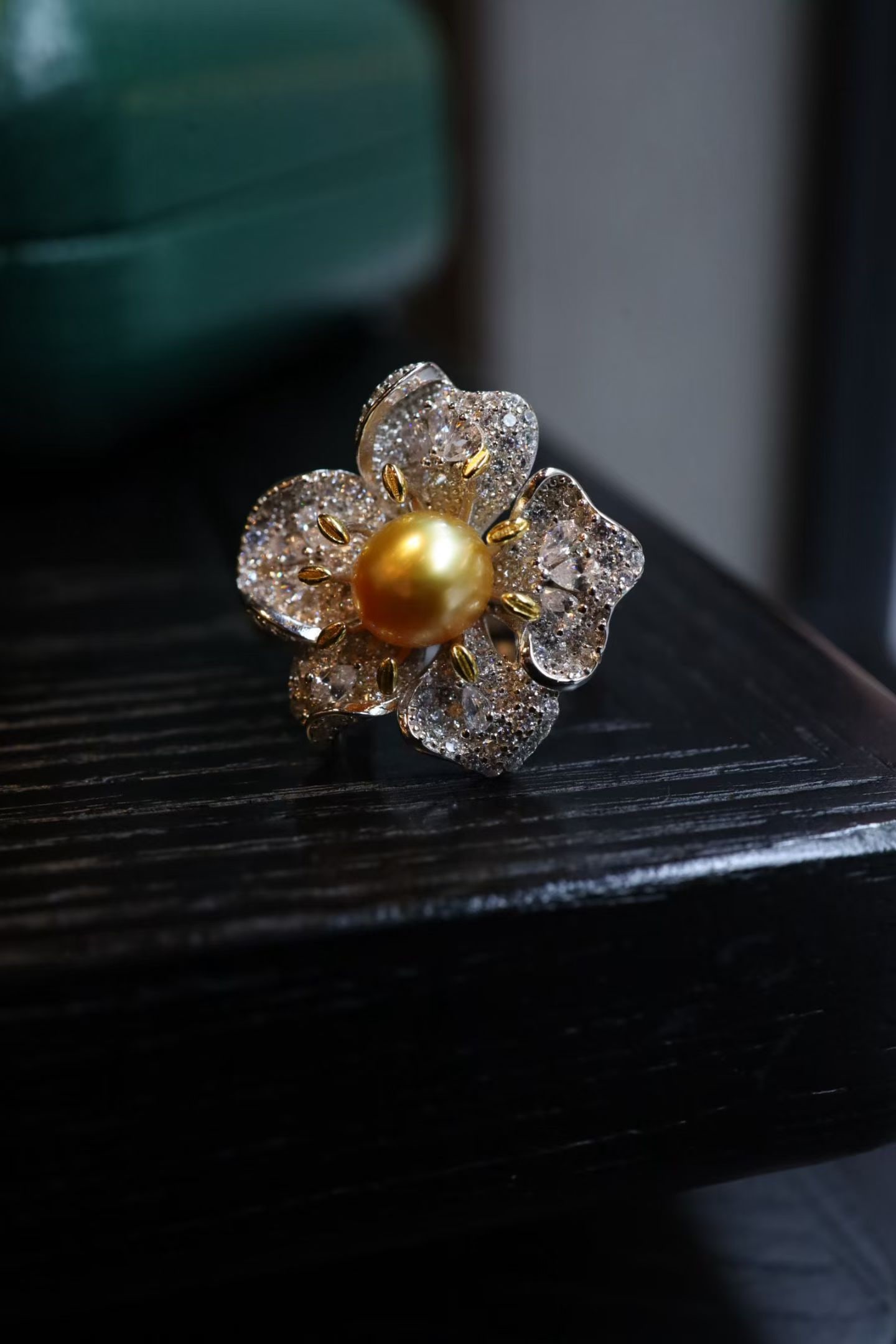 Golden South Sea Pearl Ring: Title: Golden South Sea Pearl Ring Description: This Ring showcases a stunning gold South Sea pearl, renowned for its high quality and rich golden hue. The pearl's natural luster is beautifully