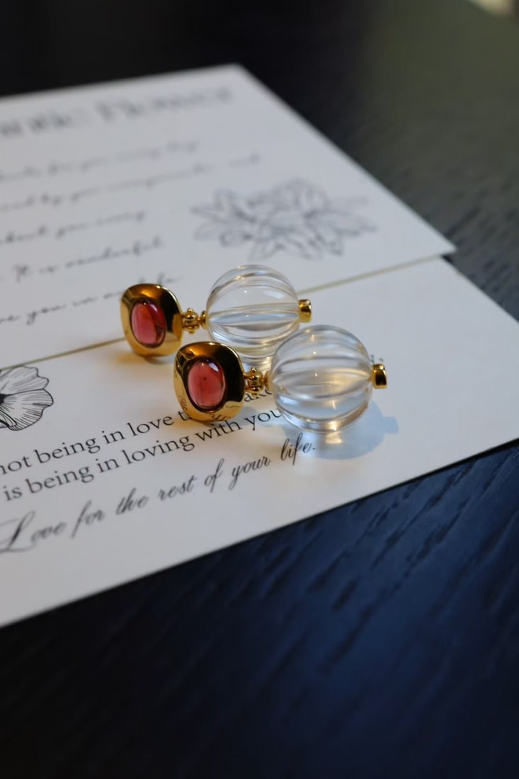 Silver Garnet Crystal Earrings: Title: Silver Garnet Crystal Earrings Description: This pair of earrings captivates with its simple yet striking design, offering a refreshing allure that instantly catches the eye. Crafted from pure