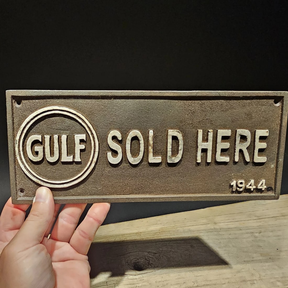 Cast Iron Gulf Gas Oil Sign Plaque: 9 " W x 3 " H Wonderful reproduction cast iron Gulf sold here sign. Great heavy piece with raised letters. Hard to tell its age for sure. Reserve: $25.00 Shipping: Domestic: Flat-rate of $9.00 to